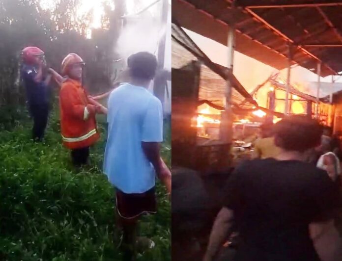 Petugas Damkarmat Banyuwangi dibantu warga memadamkan kebakaran kendang ayam di Desa Sempu, Kecamatan Sempu, Kamis (25/9/2025). (Foto/Humas Damkarmat Banyuwangi)